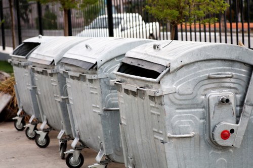 Driver inspecting a waste collection vehicle during a daily safety check